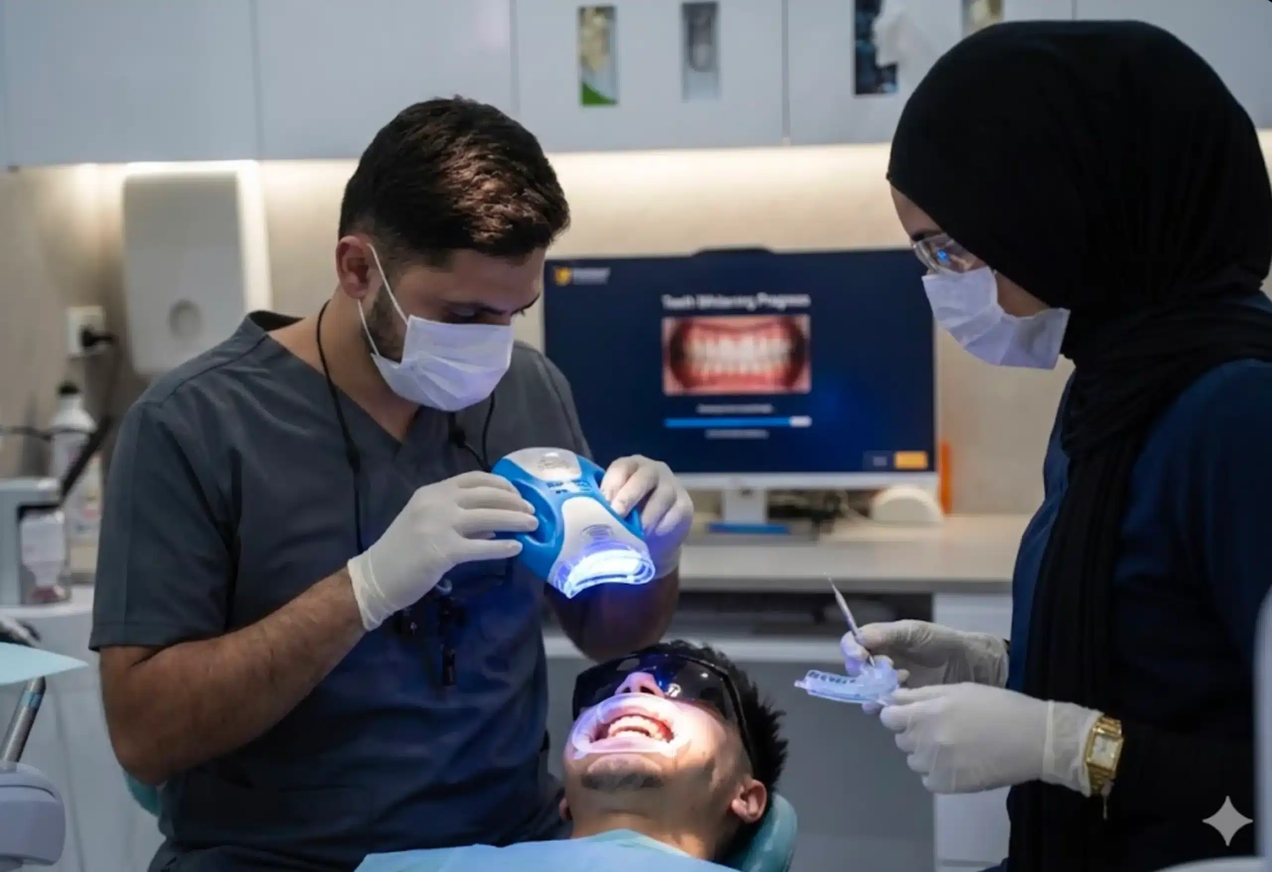A Hayat Dental dentist reviewing a treatment plan on screen